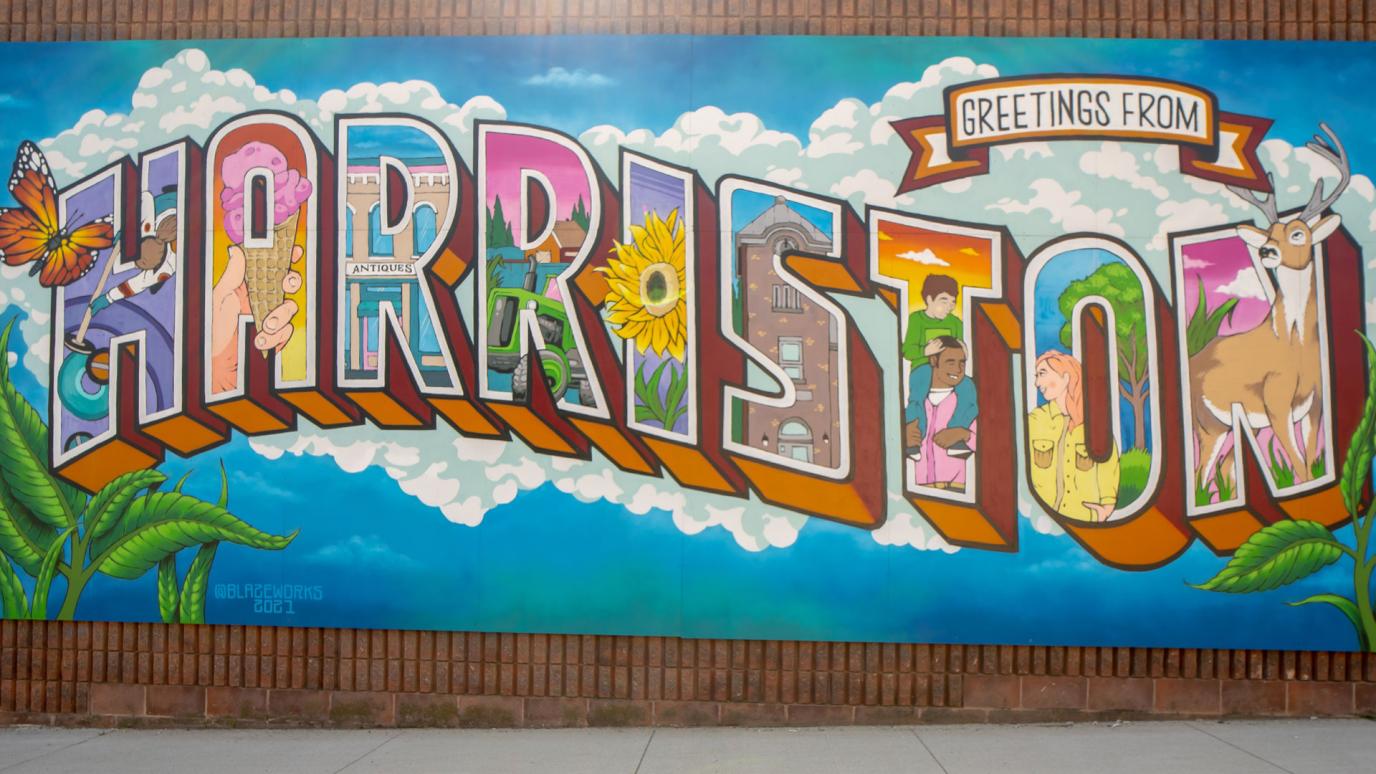 Vibrant Harriston Mural with colourful illustrations of the town in each letter