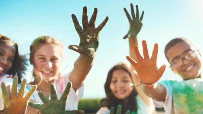 kids showing off their messy hands