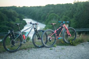 bikes leaning against rail with river in the background
