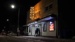 group of people walking inside a theatre