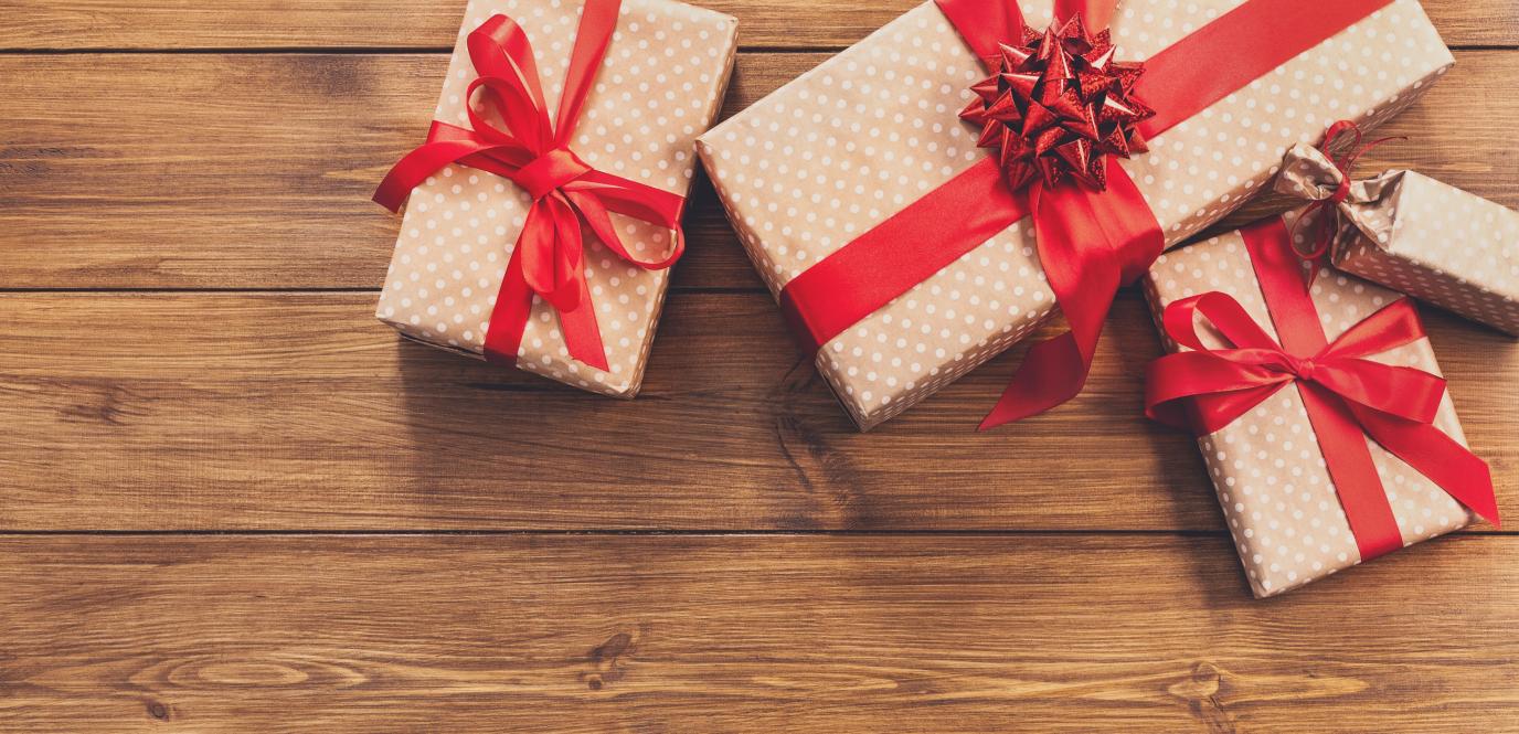 presents with red bows on table
